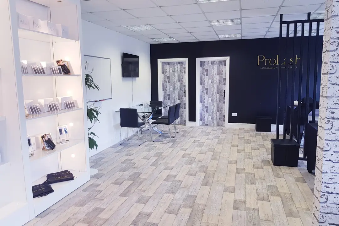 Shelves with ProLash lash products, a theory table and a whiteboard in the first academy